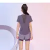 Camiseta deportiva de malla con retazos de moda para mujer, verano transpirable, dobladillo curvo, corte entallado, manga corta para fitness yoga