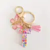 2024 transfronterizo en stock rosa lentejuelas resina 26 letras inglesas llavero colgante mariposa borla accesorios