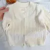 Suéter tejido para niños, colección otoño 2026, nuevo suéter de punto trenzado liso, top de punto elegante para niños y niñas