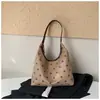 Colección de otoño 2026 transfronteriza: diseño único, gamuza de lunares, bolso de hombro color block, bolso de axila moderno y retro