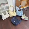 Bolso Versátil Grande de Hombro y Cruzado para Mujer Estilo Coreano Dulce y Moderno Modelo Nuevo 2026 para la Escuela y el Trayecto Bolso de Mano
