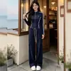 Conjunto de Dos Piezas Deportivo para Mujer de Primavera y Otoño: Top a Rayas con Cuello Alto y Bloques de Color con Cremallera y Pantalones Anchos con Cordón, Venta al por Mayor Transfronteriza
