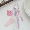 Colgante de bolsa de cinta de encaje rosa dulce con forma de corazón estilo coreano con llavero de oso y lazo lindos para mochilas de niñas