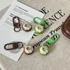 Llavero de coco, juguete de comida simulada, colgante de coco verde, accesorio de bolsa de recuerdo navideño, accesorio divertido, regalo al por mayor