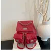 Mochila de alta calidad estilo Chanel para mujer, modelo nuevo 2026 en patrón de diamante rosa, versátil con múltiples bolsillos y asa de cadena