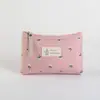 Bolsa de maquillaje de lona con estampado de letras estilo Ins, impermeable y portátil, adecuada para estudiantes como portalápices u organizador de artículos de tocador de viaje.