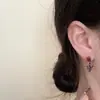 Dulce Fresca Chica Picante Serpiente Enroscada Cruz Hueso de la Oreja Clavo de Oreja Nicho Diseño de Sentido Avanzado Pendientes Europeos y Americanos Pendientes Elegantes de Moda