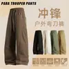 Calça Paracaidista Casual à Prova de Três Elementos Nova para Homens e Mulheres Estilo Hong Kong Solta com Múltiplos Bolsos Perna Reta Perna Larga Calça com Rebites Machete
