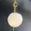 Venta Directa de Fábrica Colgante de Bola de Pelo de Conejo Sintético Accesorios para Mascotas Materiales para Juguetes Colgante para Bolso Llavero Bola Redonda