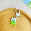 Llavero con forma de gato y manzana verde, ideal como regalo para una estudiante, mochila escolar o para colgar en la mochila.