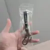 Venta al por mayor de llaveros populares para coche y llaveros de alta gama para motocicleta, perfectos como accesorios decorativos y pequeños regalos para exportación