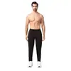 Pantalones de correr profesionales para hombre, diseñados para carreras matutinas, maratones y carreras nocturnas. Presentan tejido de secado rápido, bolsillos y forro polar, lo que los hace adecuados para otoño e invierno.