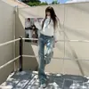 Jeans Feminino Retrô Americano de Cintura Baixa Azul Claro Lavado Stretch Skinny Reto Wide Flare para Primavera e Outono