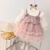 Outono 2026 Vestido Patchwork de Couro Falso Duas Peças com Laço para Meninas Pequenas Moda Bebê Menina Vestido Princesa de Malha com Manga Longa