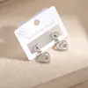 Pendientes de Aro Creativos Huecos de Amor Nuevos Más Vendidos Transfronterizos Europeos y Americanos para Mujer, Joyería de Oreja Personalizada Exquisita y de Moda al por Mayor
