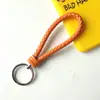Llavero creativo de cuerda de cuero tejido a mano para pareja, llavero de coche, llavero al por mayor, colgante para bolso