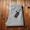 Pantalones casuales rectos holgados de algodón de fibra larga finos de alta gama para hombre, cómodos, combinan con todo, de negocios, sin planchado, primavera y verano 2023