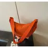 2026 Bolsa de Bolinho de Massa Artística de Cor Sólida Grande Capacidade Estilo Floresta com Contraste de Cor Verão Casual Esportiva com Alça de Ombro Transversal para Mulheres