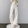 Fotos reales de los nuevos pantalones blancos de pierna ancha estilo americano para mujer de otoño 2026, casuales y de corte holgado, con un diseño curvo tipo guadaña