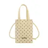 Linda mini bolsa de lunares femenina color caramelo fresco 2026 nueva versátil casual bandolera para teléfono