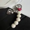 Nuevo diseño de nicho moderno llavero y colgante para bolso con cuentas coloridas en forma de corazón al por mayor