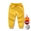Calças infantis de veludo plus outono e inverno novas meninos e meninas cor sólida quentes calças de veludo composto calças esportivas de bebê atacado