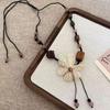 Novo estilo étnico chinês retro colar de corda de cerâmica estilo Dunhuang feminino nicho high-end estilo zen lã corrente acessórios