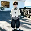 Conjunto de Camisa Falsa de Duas Peças para Meninos Primavera e Outono 2026 Outono Novo Conjunto de Moletom Infantil com Calça Jeans Curvada Tendência