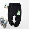 Pantalones casuales holgados para niños pequeños de primavera Pantalones para niños Pantalones Ins Estampado de dinosaurios Pantalones para niños de primavera y otoño Transfronterizo