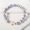 Pulsera de Porcelana Azul y Blanca con Cuentas de Forma Irregular Pulsera Cerámica con Cruz al por Mayor Colgante con Letras Wwjd Joyería al por Mayor