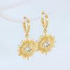 Latón baño de oro real Venta transfronteriza europea y americana incrustados circonita personalidad moda pendientes de ojo de diablo dorados