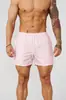 Pantalones cortos para hombre estilo americano YOUNGLA, diseñados para correr, fitness y uso casual, con tejido transpirable y de secado rápido, perfectos para la playa.