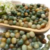 Raíz de Bodhi cuentas sueltas diy cuentas de pastel de arroz alrededor del dedo texto suave cuentas para jugar verde degradado quema de carbón Duobao bodhi mano