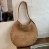 Bolso de estilo nuevo transfronterizo 2026, bolso casual para mujer, bolso de playa tipo tote de paja, bolso de mano hueco para vacaciones en la playa, bolso de hombro
