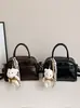 Diseño de nicho textura casual bolsa de almohada personalizada 2026 primavera nueva tendencia de moda bolso de hombro cruzado para mujer