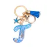 Llavero Colgante Temático Océano Azul con Borla de Estrella de Mar, Llavero de Resina Encanto para Bolso con 26 Letras