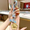 Colgante Llavero Dorado, Regalo Cultural y Creativo del Año del Caballo, Colgante Llavero Bolsa Flor de Dinero de Oro Puro, Llavero Decorativo