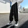Calça de moletom leve de outono para meninos com estampa de letras 2026 novo outono padrão redondo de panda estilo coreano versátil legal casual para crianças mais velhas