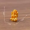 Mini santuário indiano apresentando a divindade Ganesha, uma figura fofa, acessórios de decoração DIY e um pequeno ornamento de mesa