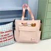 Nova bolsa de reforço fofa e amigável para estudantes, mochila minimalista com tema de floresta, bolsa de ombro casual para meninas, bolsa tote de grande capacidade
