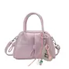 Bolsa de Mão Simples e Versátil Bolsa Estilo Bowling para Mulheres 2026 Primavera/Verão Nova Tendência Bolsa Transversal de Alto Valor Bolsa Pequena de Ombro