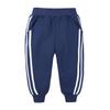 Pantalones deportivos para niños de primavera y otoño, pantalones de chándal para hombre y mujer, pantalones deportivos casuales de algodón de color sólido estilo coreano para niños medianos y pequeños