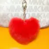 Amor llavero de peluche bolsa teléfono móvil regalo colgante forma de corazón bola de pelo pareja mochila fabricantes al por mayor