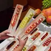 Caixa de Embalagem Tendência Pele de Leite Espinheiro Chinês Cristalizado, Espinheiro Chinês Cristalizado de Iogurte Verde Frio, Embalagem Individual de Grau Alimentício para Uso Comercial