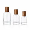 Botella de vidrio dispensadora de perfume 10/20/30/50/100ml con tapa de madera, botella vacía con atomizador, recipiente dispensador portátil para viajes