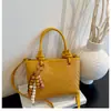 Bolsa de mão de nicho transfronteiriça bolsa saco feminina nova textura tecida retrô bolsa para o dia a dia bolsa estilosa de ombro único transversal