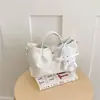 Bolso de cubo tejido de nicho transfronterizo 2026 nuevo bolso de cesta de moda para mujer bolso de mano simple para hombro cruzado
