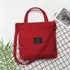 Bolsa de lona atacado de fábrica feminina 2021 Nova moda casual coreana de veludo cotelê estudante bolsa de ombro mensageiro