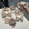 Perla amor mariposa dos puntos círculo 2023 Nueva Ola punto tocado femenino hecho a mano accesorios para el cabello de alto sentido venta al por mayor de fábrica