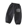 Pantalones de forro polar para niña otoño e invierno mono de terciopelo engrosado 2026 nuevo elegante invierno niña bebé casual pants deportivos dropshipping
